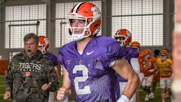 Clemson quarterback Cade Klubnik (2) runs to the outdoor fields with teammates and coaches during Spring Practice in Clemson, S.C. Monday, March 24, 2025.
