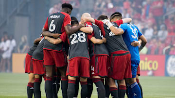 Toronto FC players huddle before the MLS game between...