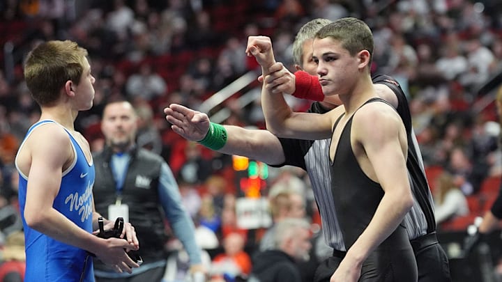 Southeast Polk’s Nico DeSalvo gets raise his hand by an official after winning over Waukee Northwest’s Joey Cahill during their 113-pound wrestling in the 3A boys state quarter-final at Wells Fargo Arena on Thursday, Feb. 20, 2025, in Des Moines, Iowa.