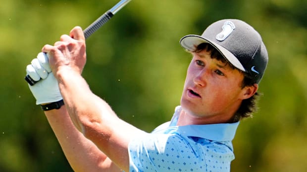 North Carolina golfer David Ford plays his tee shot on the 10th hole during the first round of NCAA Tournament. 