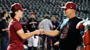 Arizona Diamondbacks Corbin Carroll (left) talks to manager Torey Lovullo during batting practice at Chase Field.