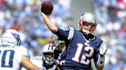 New England Patriots quarterback Tom Brady (12) throws a touchdown pass 