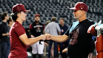 Arizona Diamondbacks Corbin Carroll (left) talks to manager Torey Lovullo during batting practice at Chase Field.