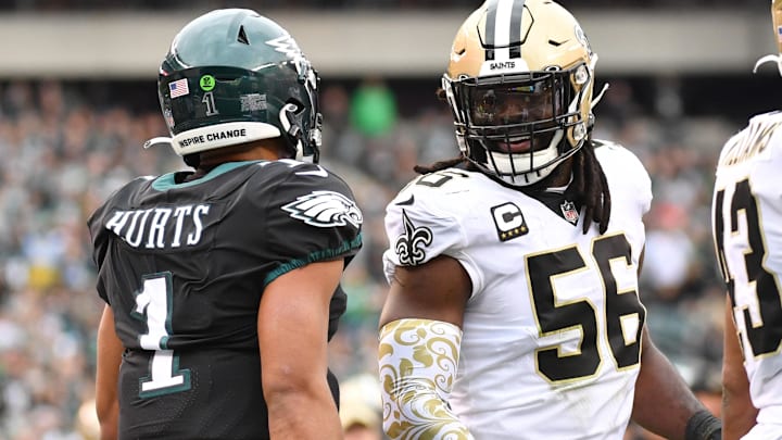 New Orleans Saints linebacker Demario Davis (56) and Philadelphia Eagles quarterback Jalen Hurts (1)