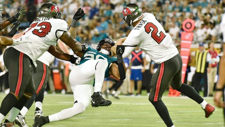 Jacksonville Jaguars defensive end Trevis Gipson (50) puts pressure on Tampa Bay Buccaneers quarterback Kyle Trask (2) on a fourth quarter pass attempt. The Jacksonville Jaguars hosted the Tampa Bay Buccaneers at EverBank Stadium for the Jaguars second preseason game of the season Saturday, August 17, 2024. [Bob Self/Florida Times-Union]