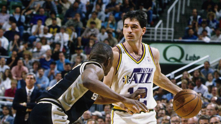 Utah Jazz guard John Stockton is defended by San Antonio Spurs guard Avery Johnson.
