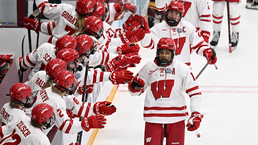 Wisconsin forward Laila Edwards is congratulated by teammates after scoring a goal against Minnesota in the first period of an NCAA women's Frozen Four semifinal on Friday, March 21, 2025, at Ridder Arena in Minneapolis.