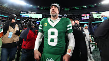 Jan 5, 2025; East Rutherford, New Jersey, USA; New York Jets quarterback Aaron Rodgers (8) walks on the field after the Jets win over the Miami Dolphins at MetLife Stadium.