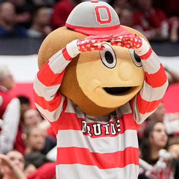 Jan 10, 2024; Columbus, Ohio, USA; Ohio State Buckeyes mascot, Brutus, cheers during the second half of the NCAA men   s basketball game against the Wisconsin Badgers at Value City Arena. Ohio State lost 71-60.