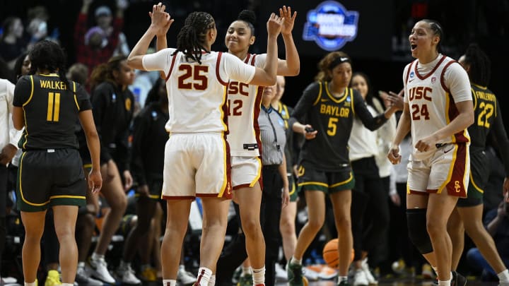 Mar 30, 2024; Portland, OR, USA; USC Trojans guard JuJu Watkins (12) celebrates with guard McKenzie Forbes (25) and forward Kaitlyn Davis (24) after a game against the Baylor Lady Bears in the semifinals of the Portland Regional of the 2024 NCAA Tournament at the Moda Center. Mandatory Credit: Troy Wayrynen-USA TODAY Sports