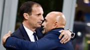 Massimiliano Allegri (L), head coach of Juventus FC, hugs...