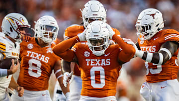 Texas Longhorns linebacker Anthony Hill Jr. (0) celebrates sacking Louisiana Monroe Warhawks quarterback General Booty (14) in the first half of the Texas Longhorns' game against the ULM Warhawks at Darrell K Royal Texas Memorial Stadium.