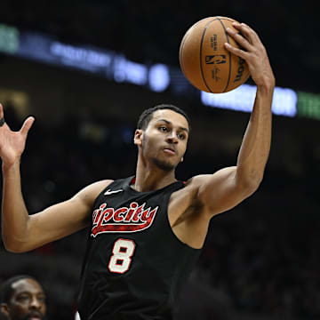 Apr 12, 2024; Portland, Oregon, USA; Portland Trail Blazers forward Kris Murray (8) grabs a rebound during the second half against the Houston Rockets at Moda Center. Mandatory Credit: Troy Wayrynen-Imagn Images