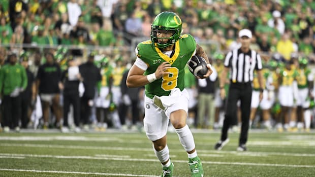 Oregon Ducks quarterback Dillon Gabriel (8) rushes into the end zone for a touchdown during the first half against the Boise 