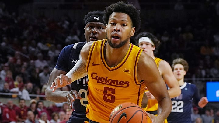 Iowa State Cyclones forward Joshua Jefferson (5) drives with the ball to the basket around FDU Knights forward Taeshaud Jackson (2) during the first half of the season-opener on Nov. 3, 2025, at Hilton Coliseum in Ames.