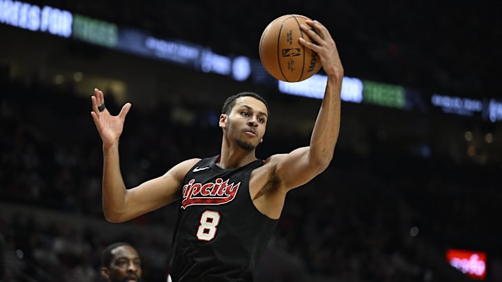 Apr 12, 2024; Portland, Oregon, USA; Portland Trail Blazers forward Kris Murray (8) grabs a rebound during the second half against the Houston Rockets at Moda Center. Mandatory Credit: Troy Wayrynen-Imagn Images