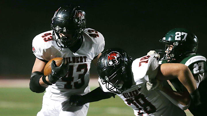 Gilbert's running back/linebacker Will Hawthorne (43 runs with the ball against Pella in the 4A state quarter final during first quarter at Central College Football field on Friday, Nov.8, 2024, in Pella, Iowa. Gilbert's running back/linebacker Will Hawthorne (43 runs with the ball against Pella in the 4A state quarter final during first quarter at Central College Football field on Friday, Nov.8, 2024, in Pella, Iowa.