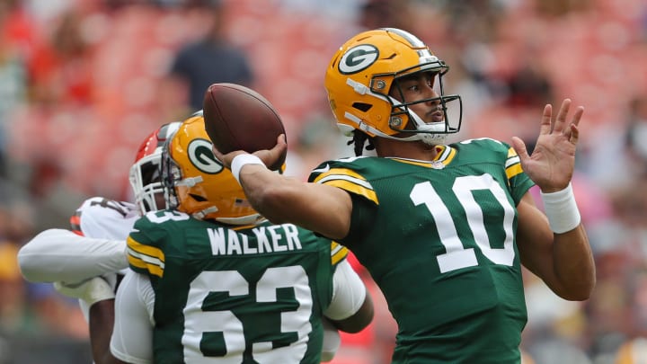 Green Bay Packers quarterback Jordan Love (10) throws a pass at Cleveland with pass protection by Rasheed Walker.