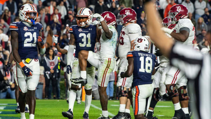 Alabama Crimson Tide wide receiver John Metchie III (8) celebrates his touchdown catch during overtime.