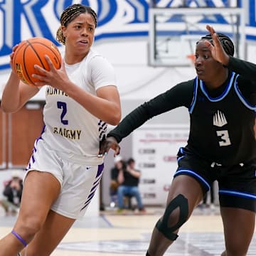 Saniyah Hall (left) of Montverde Academy drives to the basket while defended by IMG Academy's Nylah Wilson in the title game of 2025 Chipotle Nationals. Hall, the nation's No. 1 recruit from the Class of 2026, committed to USC on Friday. 