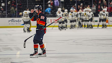 Coachella Valley forward Logan Morrison skates off the ice as Henderson Silver Knights players celebrates a win after their game at Acrisure Arena in Palm Desert, Calif., Wednesday, March 19, 2025.
