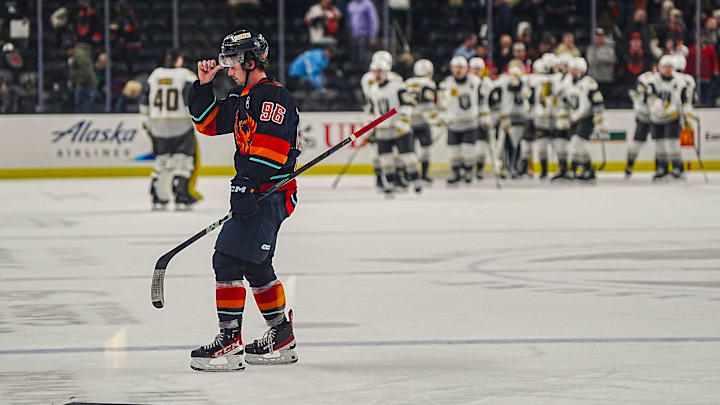 Coachella Valley forward Logan Morrison skates off the ice as Henderson Silver Knights players celebrates a win after their game at Acrisure Arena in Palm Desert, Calif., Wednesday, March 19, 2025.