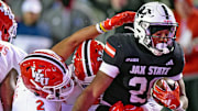 Jacksonville State's Tre Stewart tries to evade the tackle of Western Kentucky's Terreance Ellis during the C-USA Championship at AmFirst Stadium in Jacksonville, Alabama , Alabama December 6, 2024. (Dave Hyatt / Hyatt Media LLC)