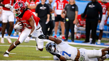 Austin Peay defensive back Javious Bond (2) carries the ball as Middle Tennessee safety Brendon Harris (7) tries to stop him during MTSU's first home football game of the season against Austin Peay, on Saturday, Aug. 30, 2025.
