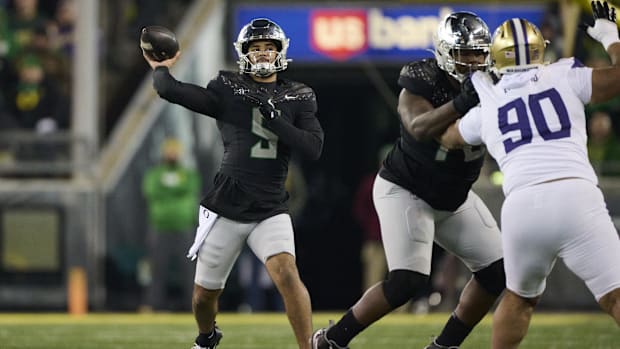 Nov 30, 2024; Eugene, Oregon, USA; Oregon Ducks quarterback Dante Moore (5) throws a pass during the second half against the 