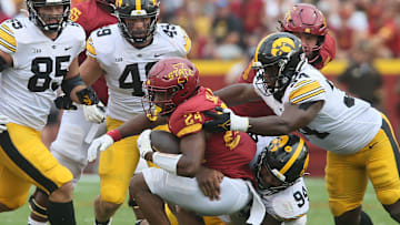 Iowa State Cyclones' running back Abu Sama (24) gets tackle by Iowa Hawkeyes' defensive line Yahya Black (94) and linebacker Jay Higgins (34) after making a first down during the third quarter of the cy-Hawk football game at the Jack Trice Stadium on Saturday, Sept. 9, 2023, in Ames, Iowa.