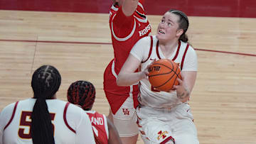 Iowa State Cyclones' forward Addy Brown (24) looks for a shot around Houston Cougars guard Summer Bostock (8) during the third quarter in the Big-12 women’s basketball at Hilton Coliseum on Wednesday, Feb19, 2025, in Ames, Iowa.