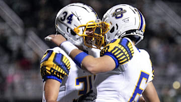 Olentangy Kaden Gebhardt (34) celebrates with teammate Ethan Grunkemeyer (6)
