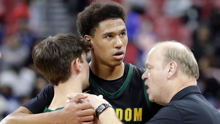 Assistant coachTom Wisneski embraces Freedom High School's Drew Kortz (5) and Donovan Davis (24) following the team;s loss to Milwaukee Academy of Science during their Division 3 championship game in the WIAA state boys basketball tournament on Saturday, March 22, 2025, at the Kohl Center in Madison, Wis. Milwaukke Acedemy of Science defeated Freedom 57–54.
Wm. Glasheen USA TODAY NETWORK-Wisconsin