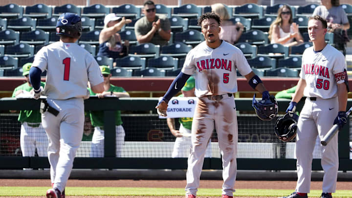 Arizona Wildcats Chase Davis (5) reacts after Garen Caulfield (1) hit a two-run home run against the Oregon Ducks in the second inning during the Pac-12 Baseball Tournament at Scottsdale Stadium on May 25, 2022. Arizona Wildcats Chase Davis (5) reacts after Garen Caulfield (1) hit a two-run home run against the Oregon Ducks in the second inning during the Pac-12 Baseball Tournament at Scottsdale Stadium on May 25, 2022.