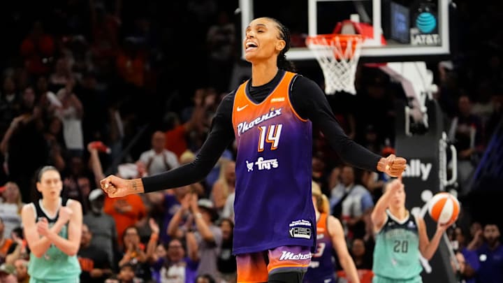 Phoenix Mercury forward DeWanna Bonner (14) reacts after making a jumper shot against the New York Liberty late in the fourth quarter during Game Three of the 2025 WNBA Playoffs first round at PHX Arena on Sept. 19, 2025, in Phoenix.
