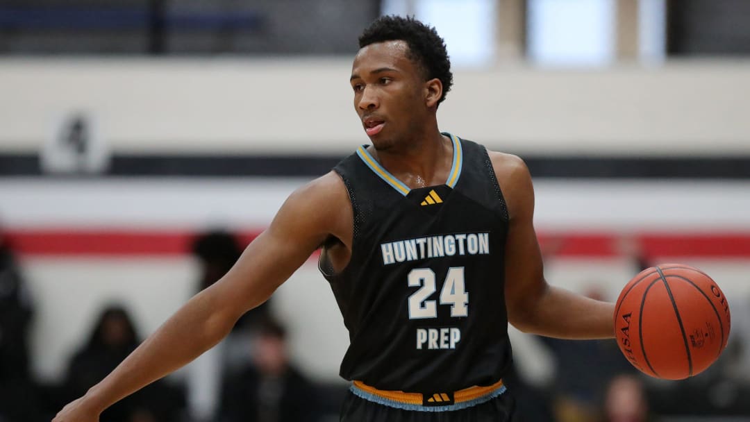 Huntington Prep guard Darryn Peterson takes the ball up the court during the first half at Canton Memorial Field House, Saturday, Feb. 17, 2024.