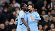 Bernardo Silva y Jeremy Doku, Manchester City