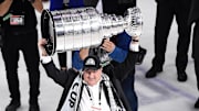 Jul 7, 2021; Tampa, Florida, USA; Tampa Bay Lightning owner Jeff Vinik hoists the Stanley Cup after the Lightning defeated the Montreal Canadiens 1-0 in game five to win the 2021 Stanley Cup Final at Amalie Arena. Mandatory Credit: Douglas DeFelice-Imagn Images