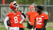 Cleveland Browns quarterbacks Kenny Pickett and Shedeur Sanders chat during an NFL offseason training camp
