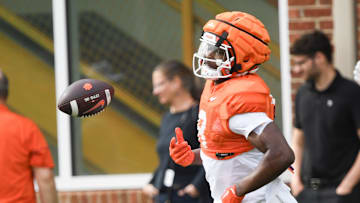 Clemson running back Gideon Davidson (9) flips the ball after a running drill during Spring Practice in Clemson, S.C. Monday, March 24, 2025.
