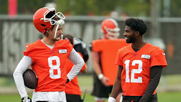 Cleveland Browns quarterbacks Kenny Pickett and Shedeur Sanders chat during an NFL offseason training camp
