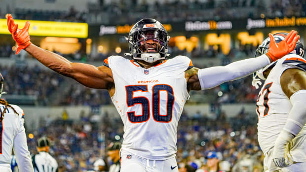 Denver Broncos linebacker Jonas Griffith (50) celebrates a touchdown.