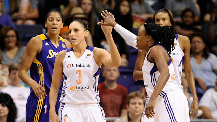 Sep 21, 2013; Phoenix, AZ, USA; Phoenix Mercury guard Diana Taurasi (3) is congratulated by teammate guard Alexis Hornbuckle (14) during the against the Los Angeles Sparks in the first half during Game 2 of a WNBA basketball Western Conference semifinal series at US Airways Center. Mandatory Credit: Jennifer Stewart-Imagn Images