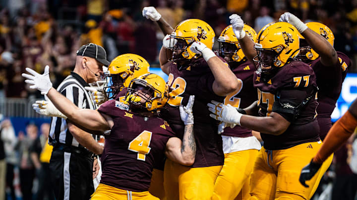 Arizona State celebrates together after running back Cam Skattebo scores a touchdown in the fourth quarter of the Peach Bowl.