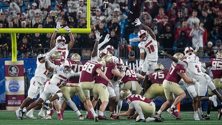 Louisville tried desperately to block a 4th quarter field goal by FSU's Ryan Fitzgerald (88), but the kick with through the uprights as the Louisville Cardinals faced off against the Florida State Seminoles at Bank of America Field in Charlotte, NC. FSU defeated Louisville 16-6 to win the 2023 ACC Championship. Dec. 2, 2023.