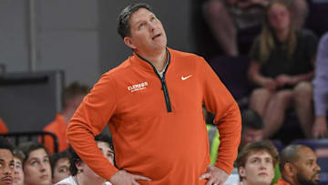 Feb 26, 2025; Clemson, South Carolina, USA; Clemson Head Coach Brad Brownell looks at a replay of his players against Notre Dame during the first half at Littlejohn Coliseum. Mandatory Credit: Ken Ruinard-Imagn Images