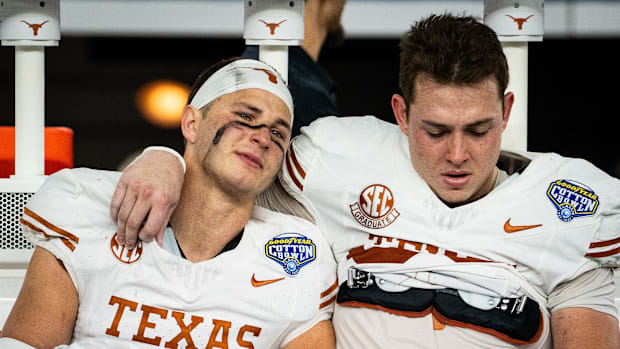 Texas Longhorns defensive back Michael Taaffe (16) and Texas Longhorns tight end Gunnar Helm (85) comfort each other while