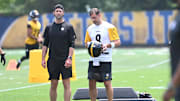 Pittsburgh Steelers quarterback Aaron Rodgers puts on his helmet during minicamp at their South Side facility