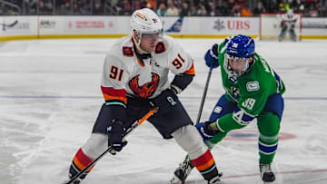 Coachella Valley forward Daniel Sprong looks to shoot while defended against by Abbotsford forward Ty Mueller during the second period of their game at Acrisure Arena in Palm Desert, Calif., Wednesday, Jan. 29, 2025.