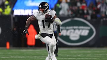 Dec 22, 2022; East Rutherford, New Jersey, USA; Jacksonville Jaguars tight end Evan Engram (17) runs with the ball against the New York Jets during the second half at MetLife Stadium. 